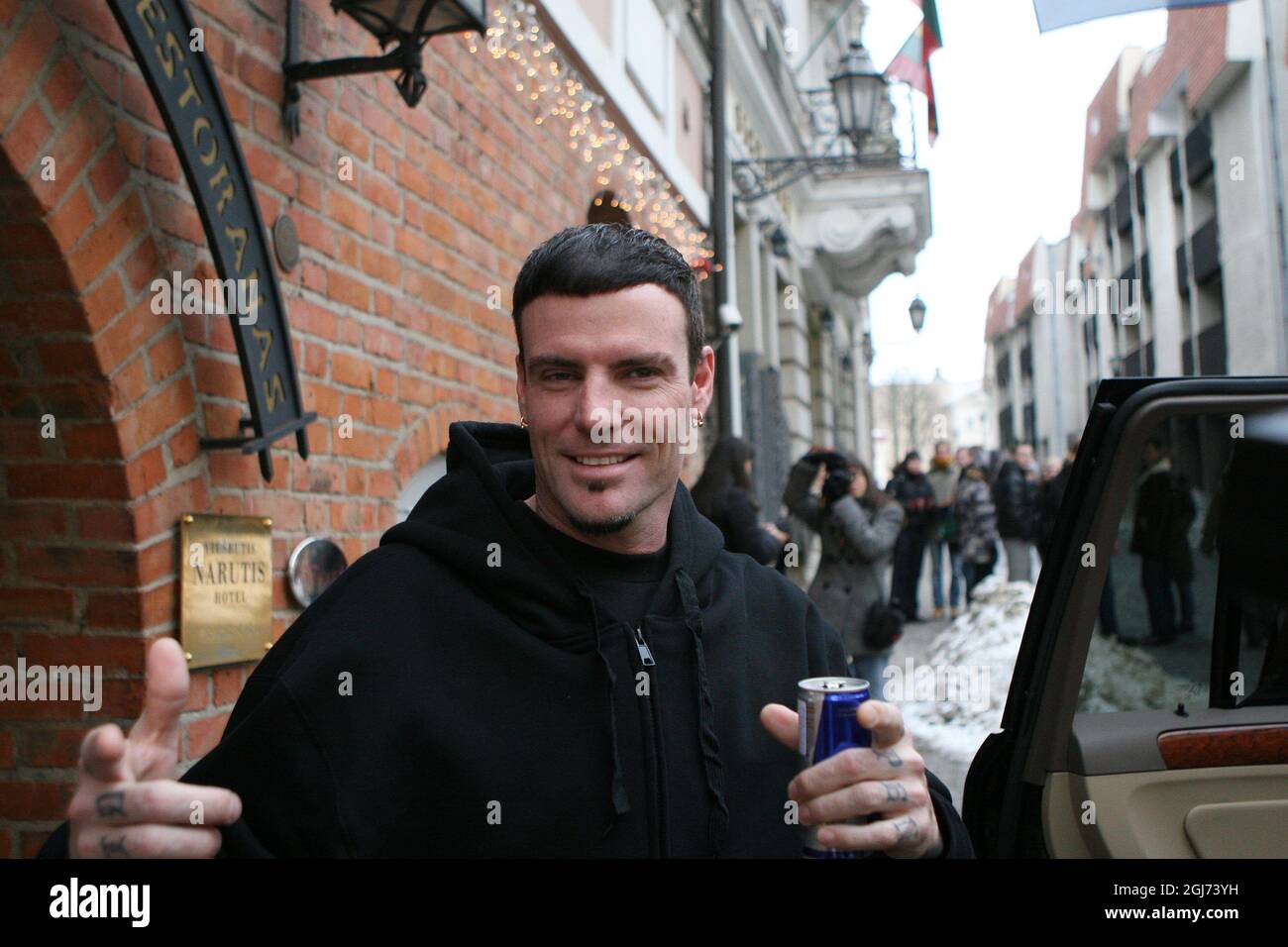 US raper Vanilla Ice jokes with photographers as he leaves hotel in old town of Vilnius. Vanilla Ice and former NBA basketball superstar Dennis Rodmann are taking part in filming new advertisment for hotels.com. Stock Photo