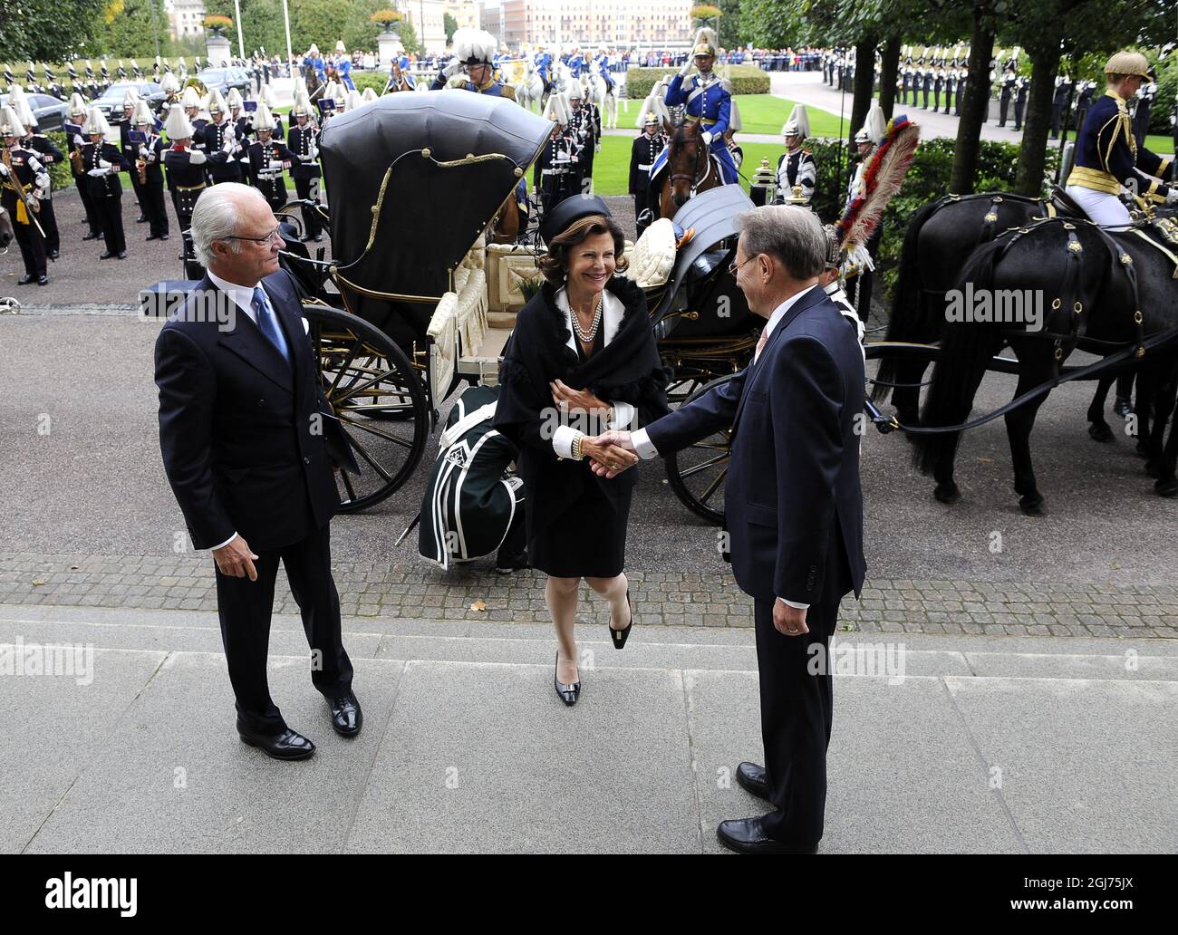 King Carl Gustaf and Queen Silvia are being welcomed by the Speaker of the Parliament, Per Westerberg, to the open9ing of the House of the Parliament in Stockholm., Sweden, September 15, 2011 Stock Photo