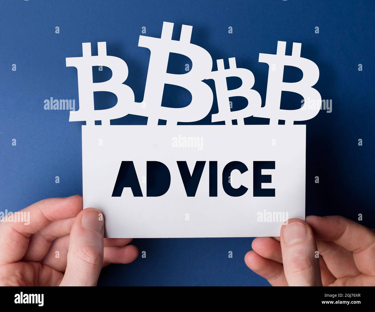 Hands holding a bitcoin cryptocurrency advice sign Stock Photo - Alamy