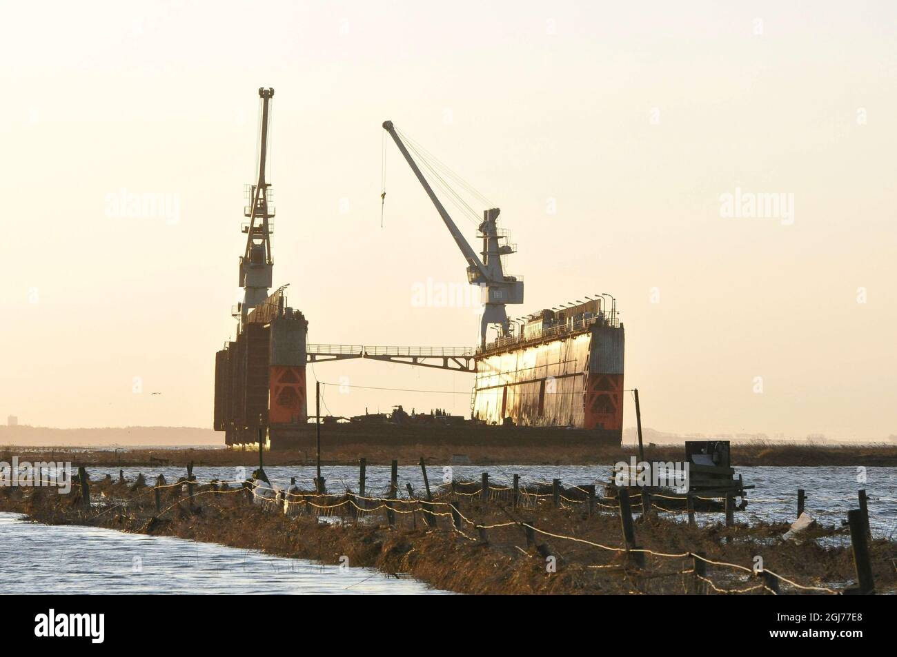 At 165 meters long an 6 000 kilotons floating dock is seen aground near the city of Landskrona, Sweden, November 28, 2011. The floating dock broke loose by the storm winds at the South Swedish coast line. Foto: Johan Nilsson / SCANPIX / Kod 50090 Stock Photo
