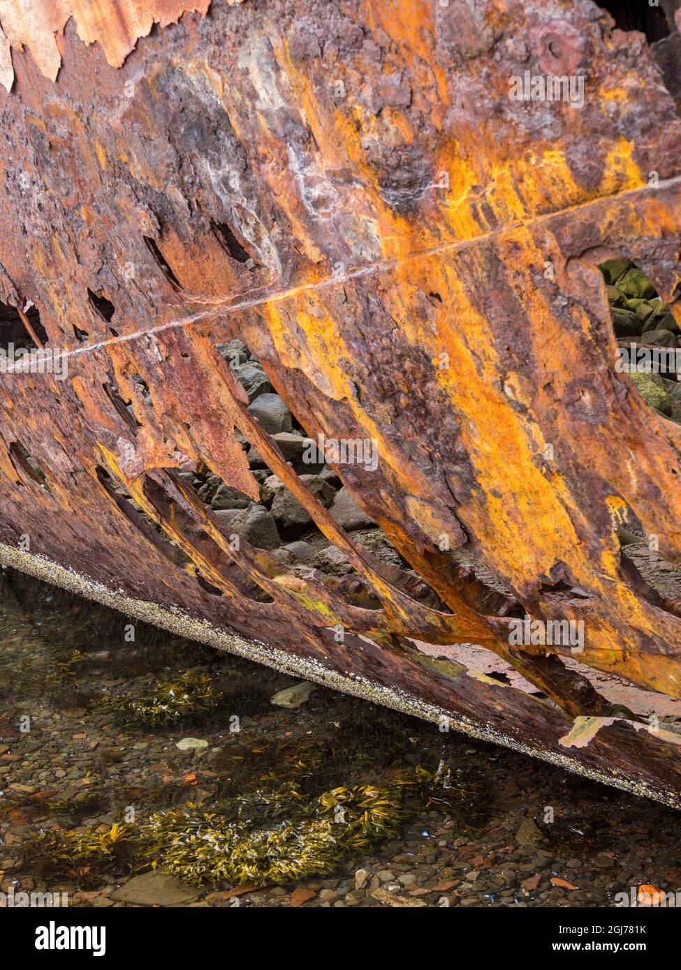 Landscape at Reykjarfjordur. The old fish factory and wreck. The ...