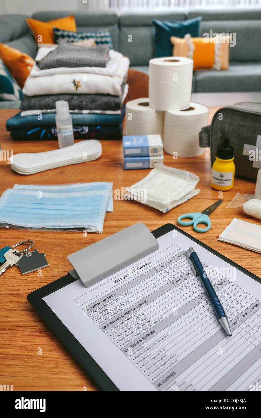 Emergency backpack checklist with necessities prepared Stock Photo Alamy