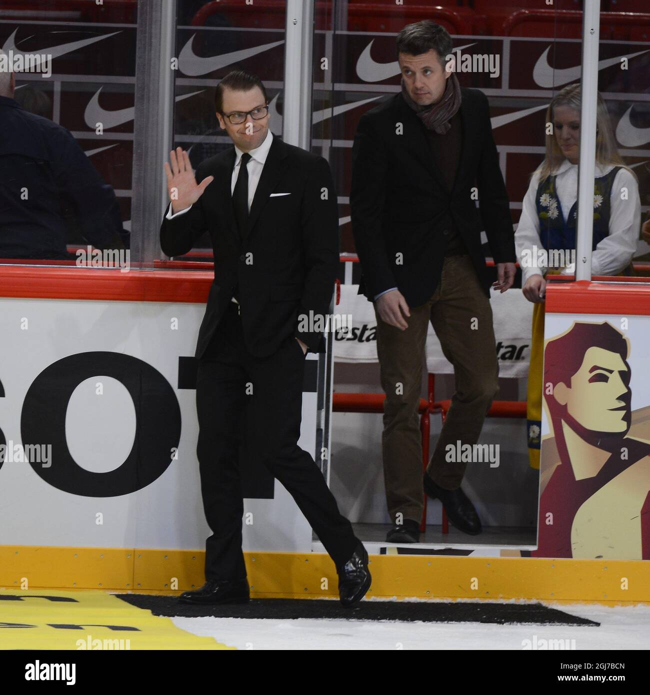 STOCKHOLM 2012-05-07 Sweden's Prince Daniel and Denmark's Crown Prince  Frederik steps out on the ice to hand over the price to the best player of  the match after the ice hockey game