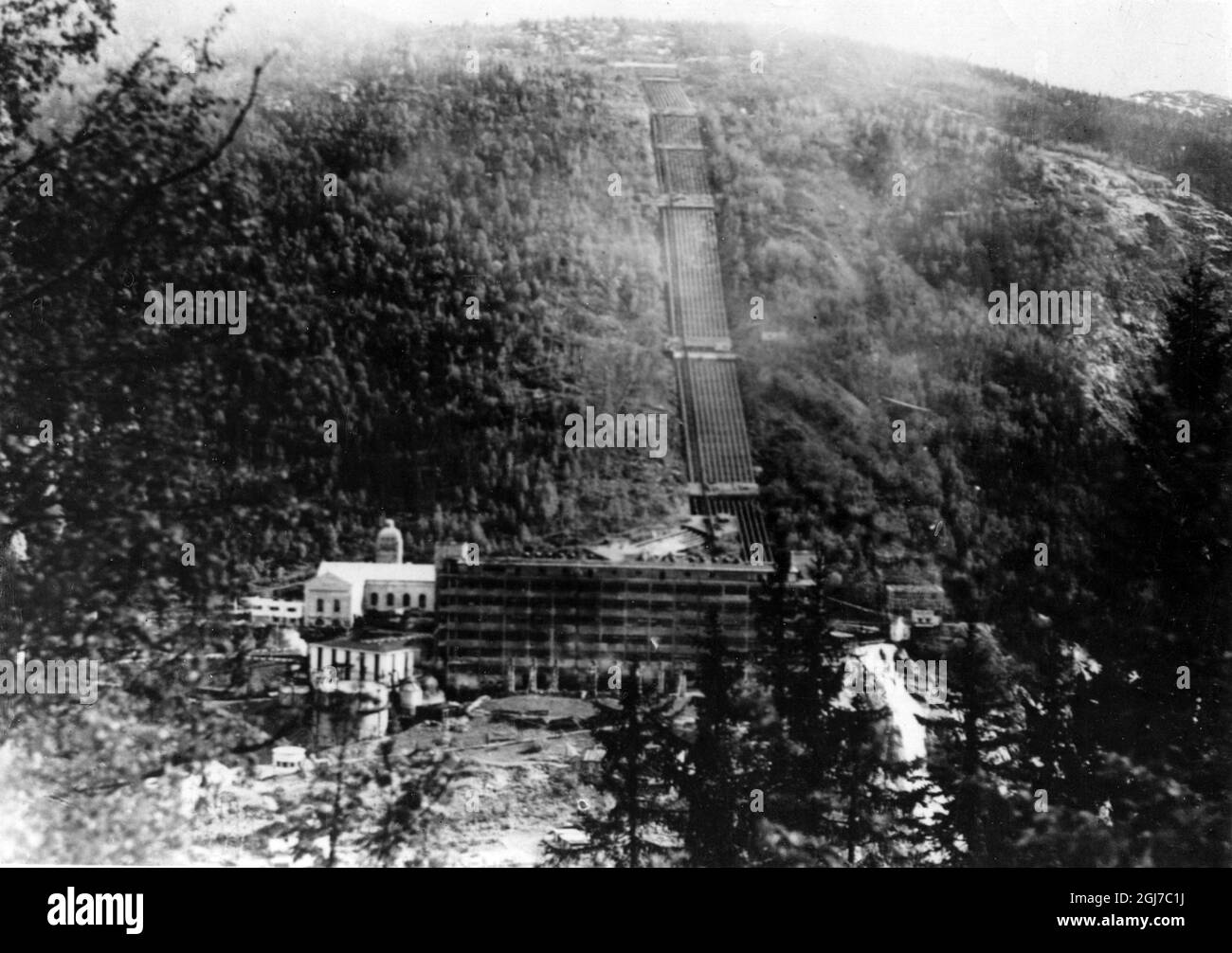 This is a photo (exact date unknown) of the heavy water plant at Rjukan on Vemork which was sabotaged on the night of February 28, 1943. The production of heavy water was of great importance for the German front. The wall in the foreground is blackened by the explosion and fire. The building was demolished in 1977.  Stock Photo
