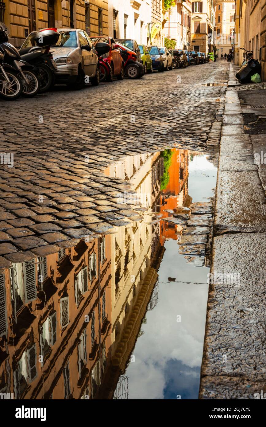 Italy, Rome. Via della Penna, side street west of Via Ripetta, with puddles  from the rain and reflection Stock Photo - Alamy