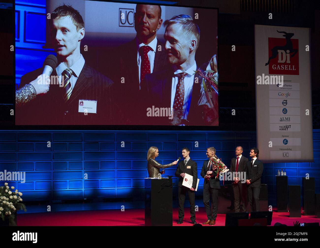 STOCKHOLM 2012-12-03  Proactive Gaming Scandinavia founder Mattias Andersson (2nd L) and MD Pal Burman (3rd L) recieves tha Gasell award from financial paper Dagens Industri managing editor Lotta Edling (L), Editor in Chief Peter Fellman (2nd R) and Prince Carl Philip (R) during the Gasell gala award ceremony at the Stockholm Concert Hall in Stockholm, Sweden, December 3, 2012.  Photo: Maja Suslin / SCANPIX / Kod 10300   Stock Photo