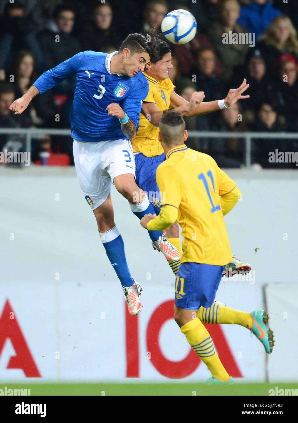 KALMAR 2012-10-16  Italy's Paolo Frascatore, left, goes for a header with Sweden's Miiko Albornoz, center, as Sweden's Mervan Celik looks on during the UEFA European Under-21 Championship qualification match between Sweden and Italy at the Guldfageln arena in Kalmar, Sweden, on Oct. 16, 2012. Photo: Patric Soderstrom / SCANPIX / code 10760   Stock Photo