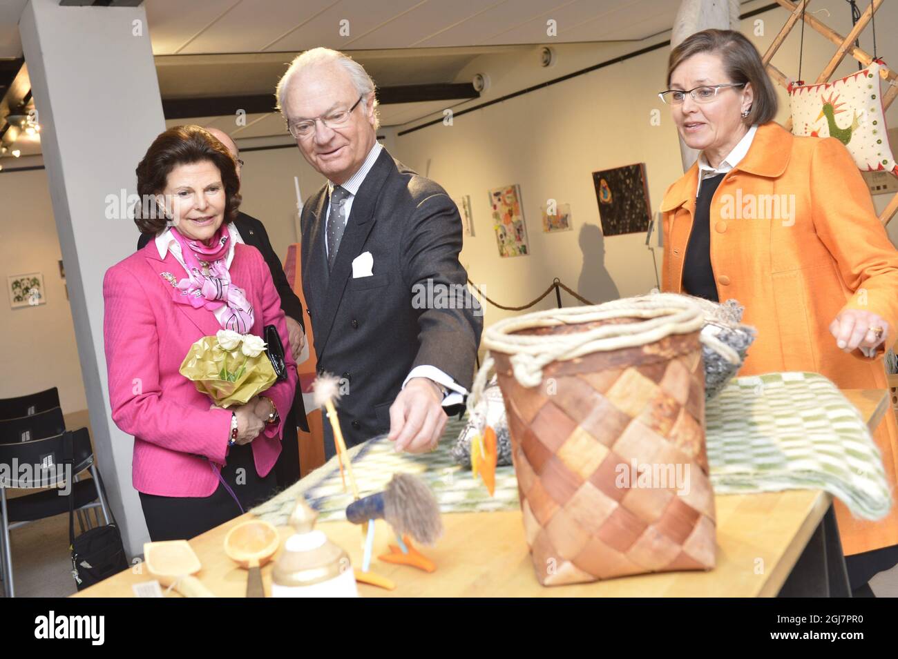 NYBRO 2013-03-06 Queen Silva and King Carl Gustaf of Sweden are guided by consultant Agneta Gefors during a handicraft exhibition in Nybro, Sweden March 6, 2013. The Royal couple is visiting the city in connection of the MonarchÂ´s 40th anniversary on the throne. Foto: Jonas EkstrÃ¶mer / SCANPIX / Kod 10030 Stock Photo