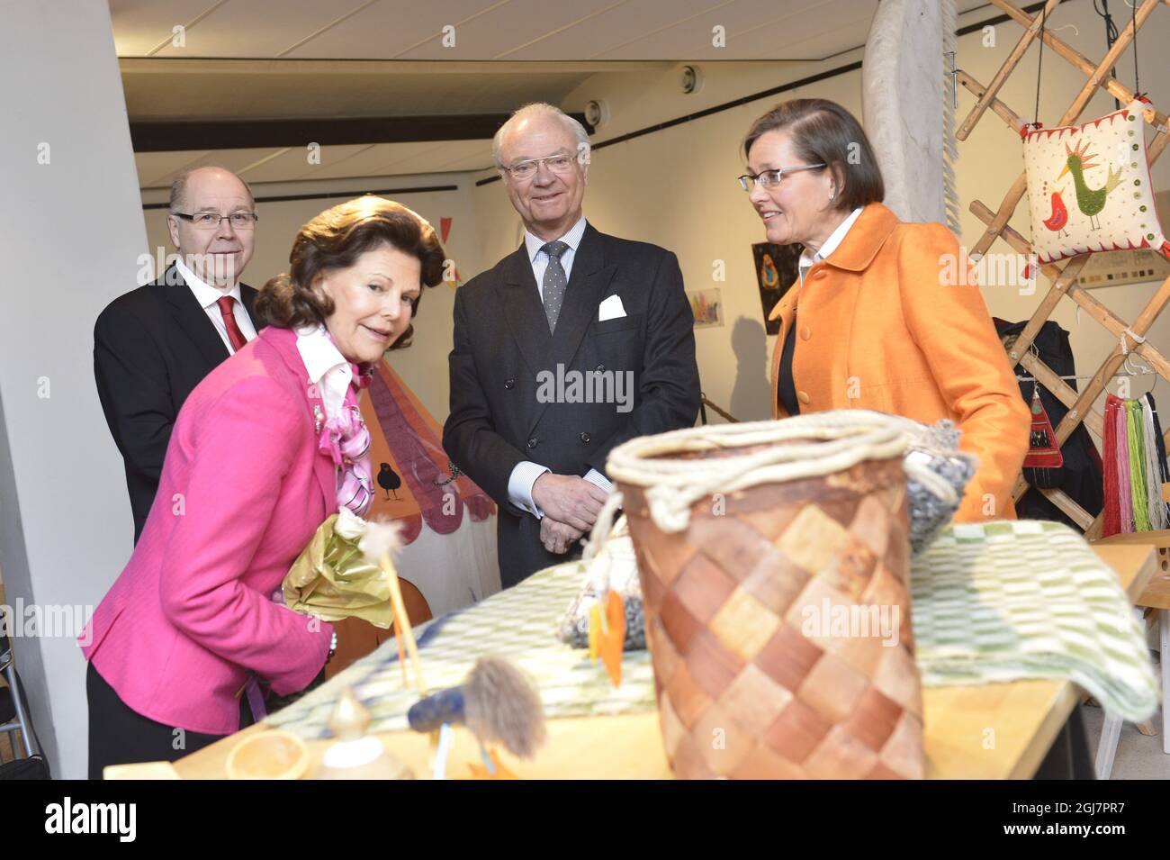 NYBRO 2013-03-06 Queen Silva and King Carl Gustaf of Sweden are guided by consultant Agneta Gefors during a handicraft exhibition in Nybro, Sweden March 6, 2013. The Royal couple is visiting the city in connection of the MonarchÂ´s 40th anniversary on the throne. Foto: Jonas EkstrÃ¶mer / SCANPIX / Kod 10030 Stock Photo