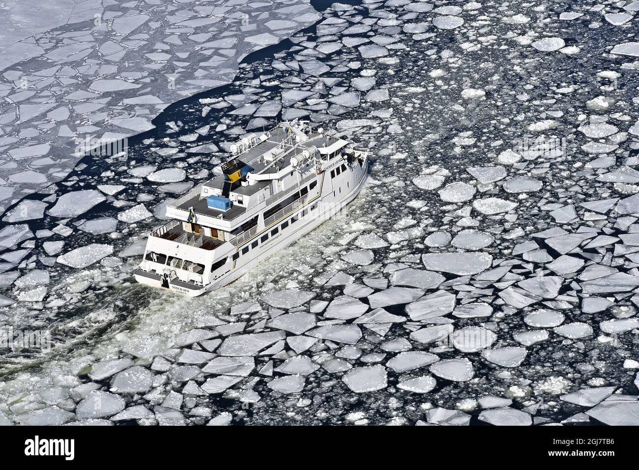 STOCKHOLM 2013-04-05 The ferry Soderarm is seen making its way through a broken ice channel to the island Husaro in StockholmÂ’s archipelago on Friday April 4, 2013. SMHI, the Swedish government agency on weather forecasts and climate, reports that there is a record spread of ice around SwedenÂ’s coasts this late in the winter. At first forecasters expected the ice on the Baltic sea to reach its maximum in late January, but a prolonged spell of high pressure that arrived over in early March caused new ice to form late in the season, resulting in the record-late date. Anders Wiklund / SCANPIX / Stock Photo