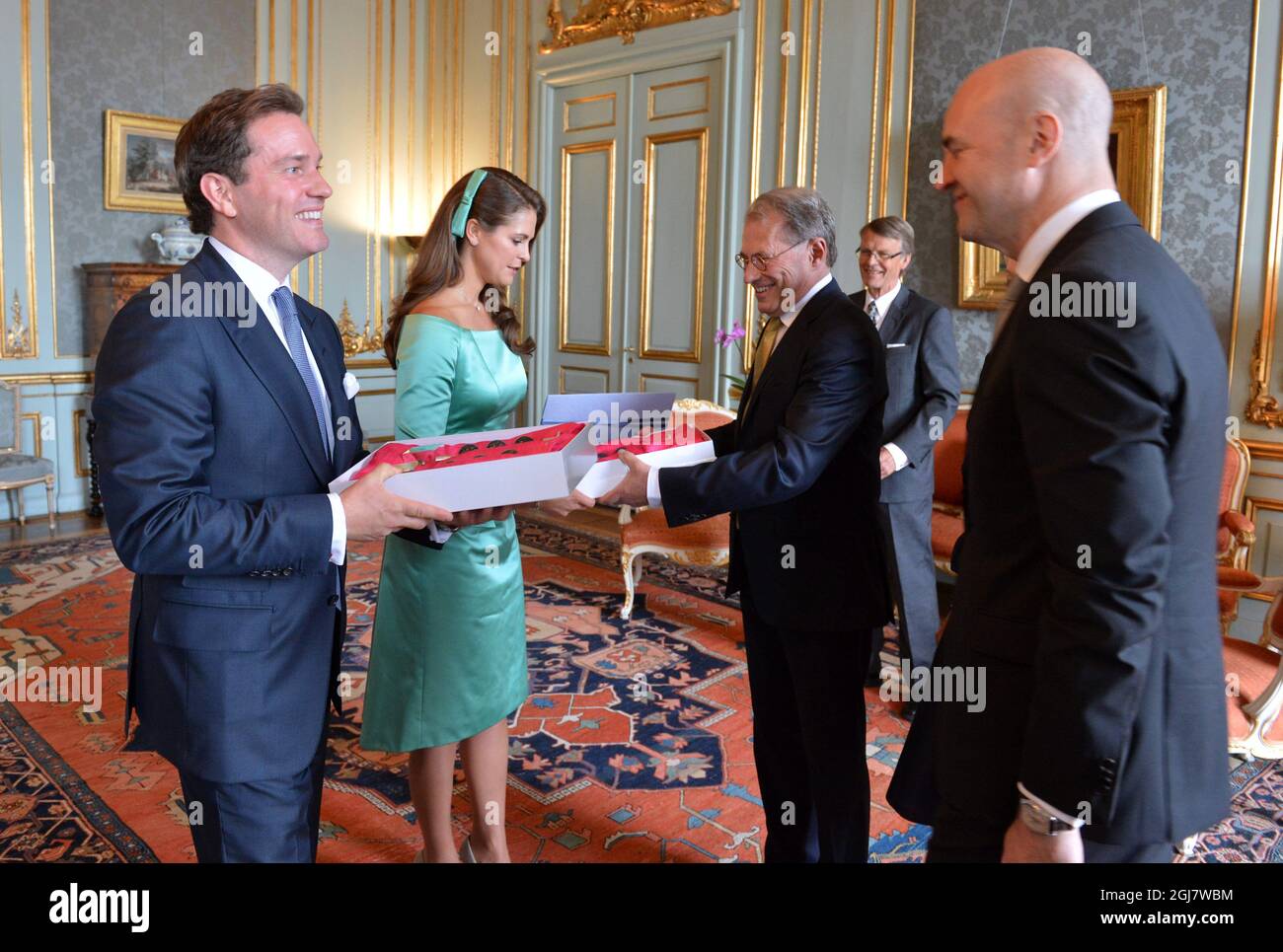 Swedish PM Fredrik Reinfeldt (R) and speaker of the Parliament Per Westerberg (2nd R) congratulate Princess Madeleine and Christopher O'Neill during the reception at the Royal Palace after the banns of marriage for Princess Madeleine and Christopher O'Neill service in the Royal Chapel in Stockholm, Sweden, May 19, 2013.     Stock Photo