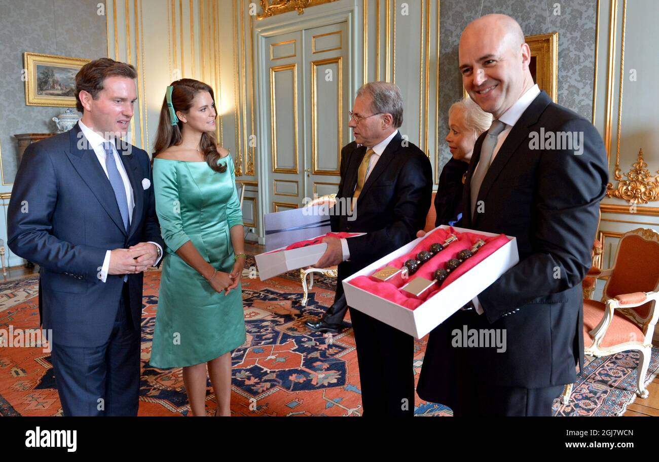Swedish PM Fredrik Reinfeldt (R) and speaker of the Parliament Per Westerberg (3rd R) with wife Ylwa congratulate Princess Madeleine and Christopher O'Neill during the reception at the Royal Palace after the banns of marriage service in the Royal Chapel in Stockholm, Sweden, May 19, 2013.     Stock Photo