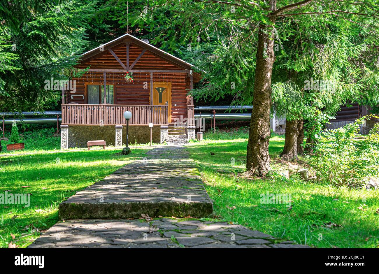 Cozy wooden house in the woods Stock Photo - Alamy
