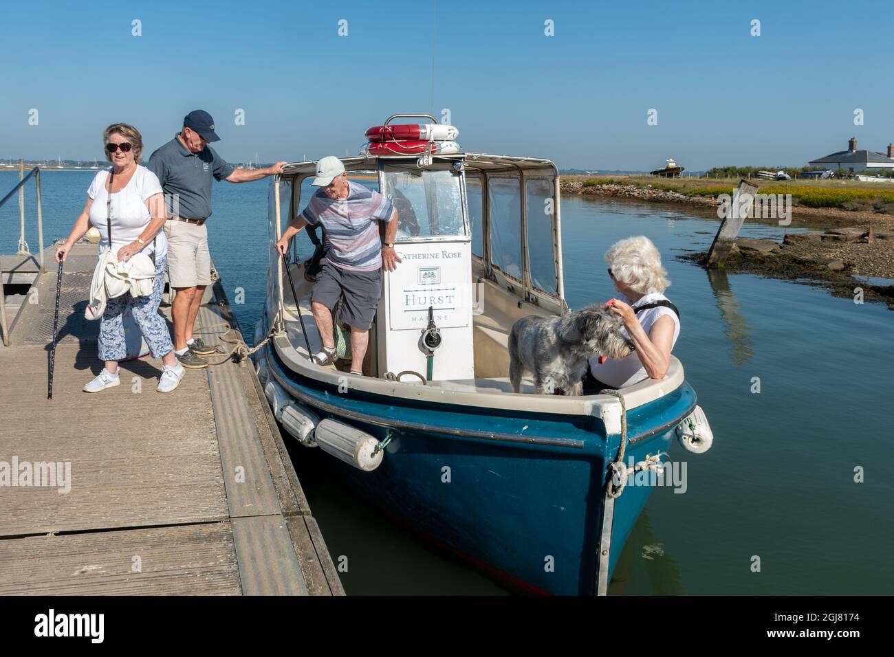 Visitors arriving at Hurst Castle on the ferry from Keyhaven on a sunny day, Hampshire, England, UK Stock Photo