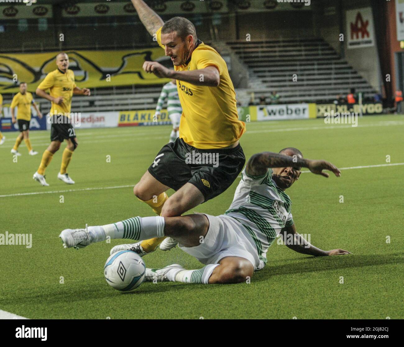IF Elfsborg's James Keene, top, fights for the ball with Celtic's Kelvin Wilson during the UEFA Champions League qualification soccer match between IF Elfsborg and Glasgow Celtic FC in Boras, Sweden, 07 August 2013. Stock Photo