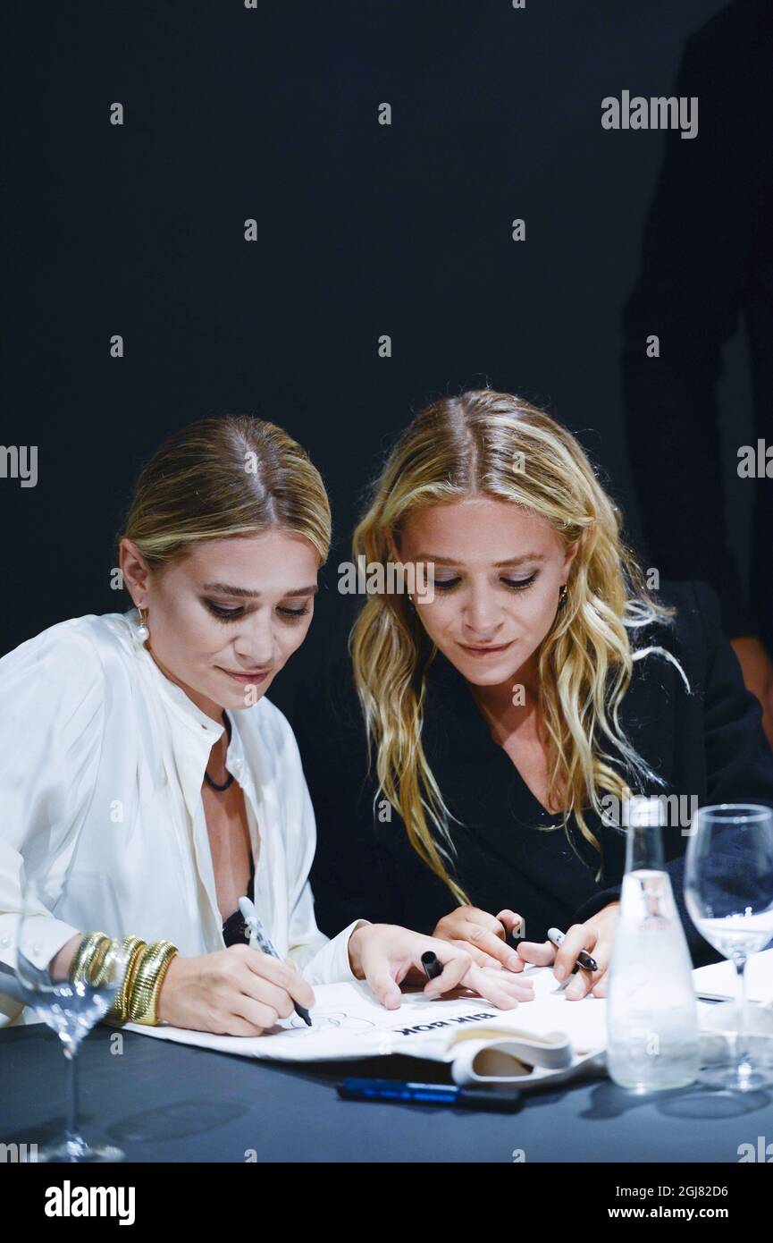 STOCKHOLM 20130808 The American actresses and entrepreneurs Olsen twins are in Stockholm to promote their cooperation with clothing brand Bik Bok. To the left Mary-Kate Olsen and to the right Ashley Olsen signing autographs. Foto: Henrik Montgomery / SCANPIX / kod: 10060  Stock Photo