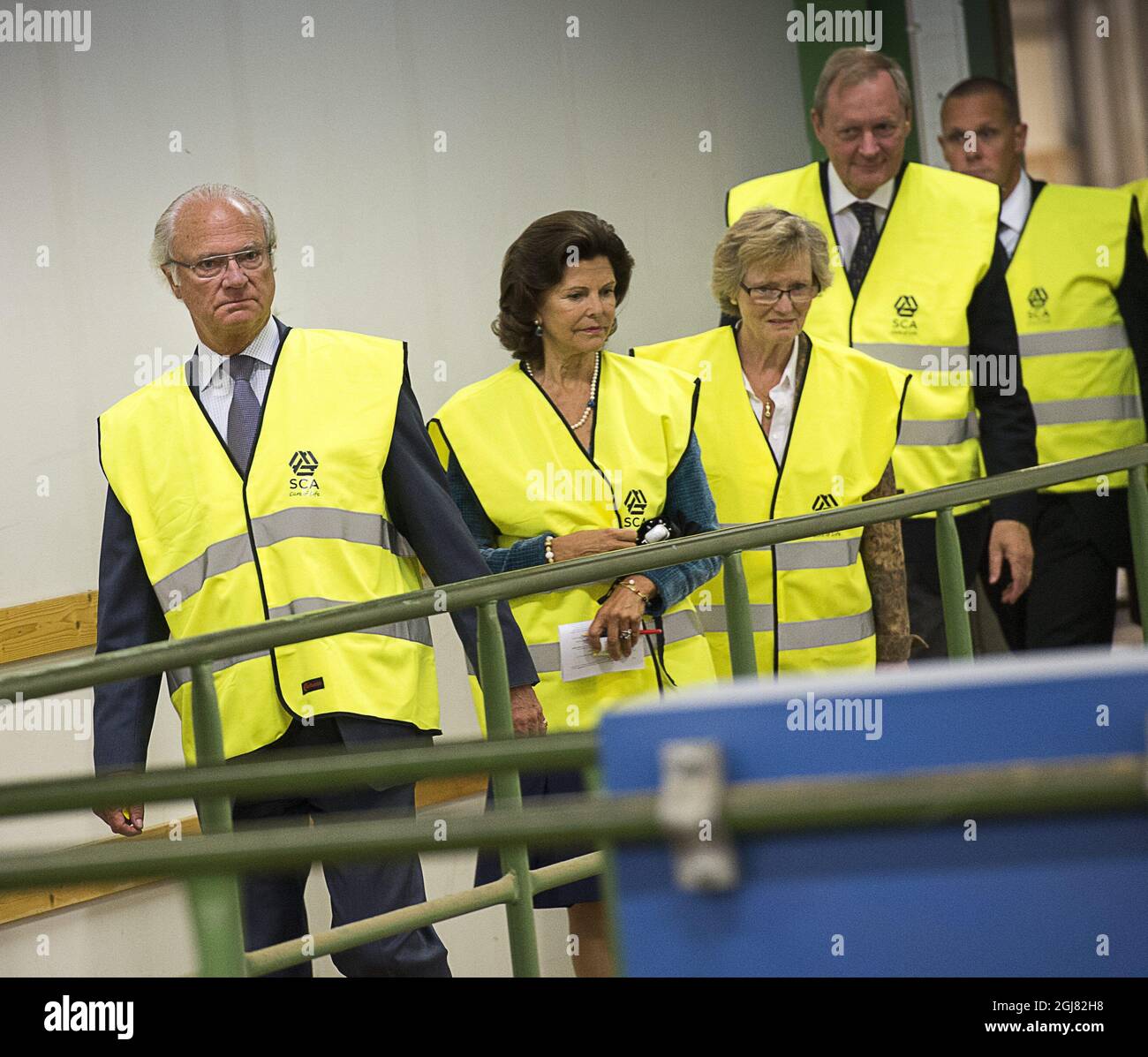 HARNOSAND 2013-08-14 King Carl Gustaf and Queen Silvia are seen during their visit to the city of Harnosand, north Sweden, August 14, 2013. Here pictured dui ring a visit to the SCA sawmill plant. The visit is a part of the KingÂ’s 40 year anniversary on the throne. Foto Jonas Ekstromer / SCANPIX kod 10030  Stock Photo