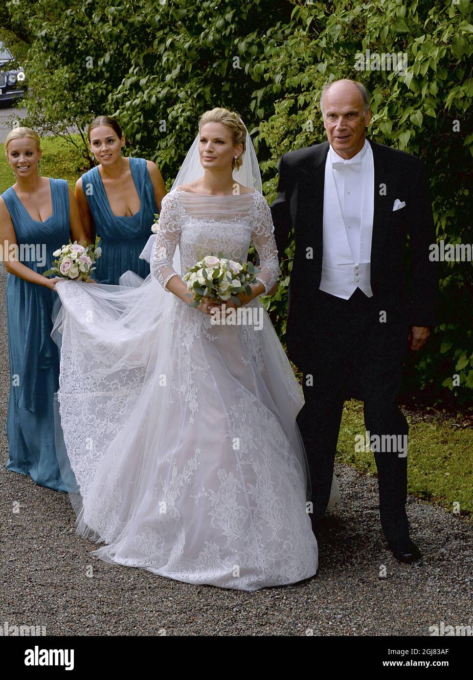 STOCKHOLM 2013-08-31 Bride Vicky AndrÃ©n and her father arrive to the wedding at the Ulriksdal Palace Chapel in Stockholm, Sweden, August 31, 2013. The Swedish Kings godson Gustaf Magnusson (son of Princess Christina and Tord Magnuson) married model Vicky AndrÃ©n Saturday. Photo Jonas Ekstromer / SCANPIX / ** SWEDEN OUT ** Stock Photo
