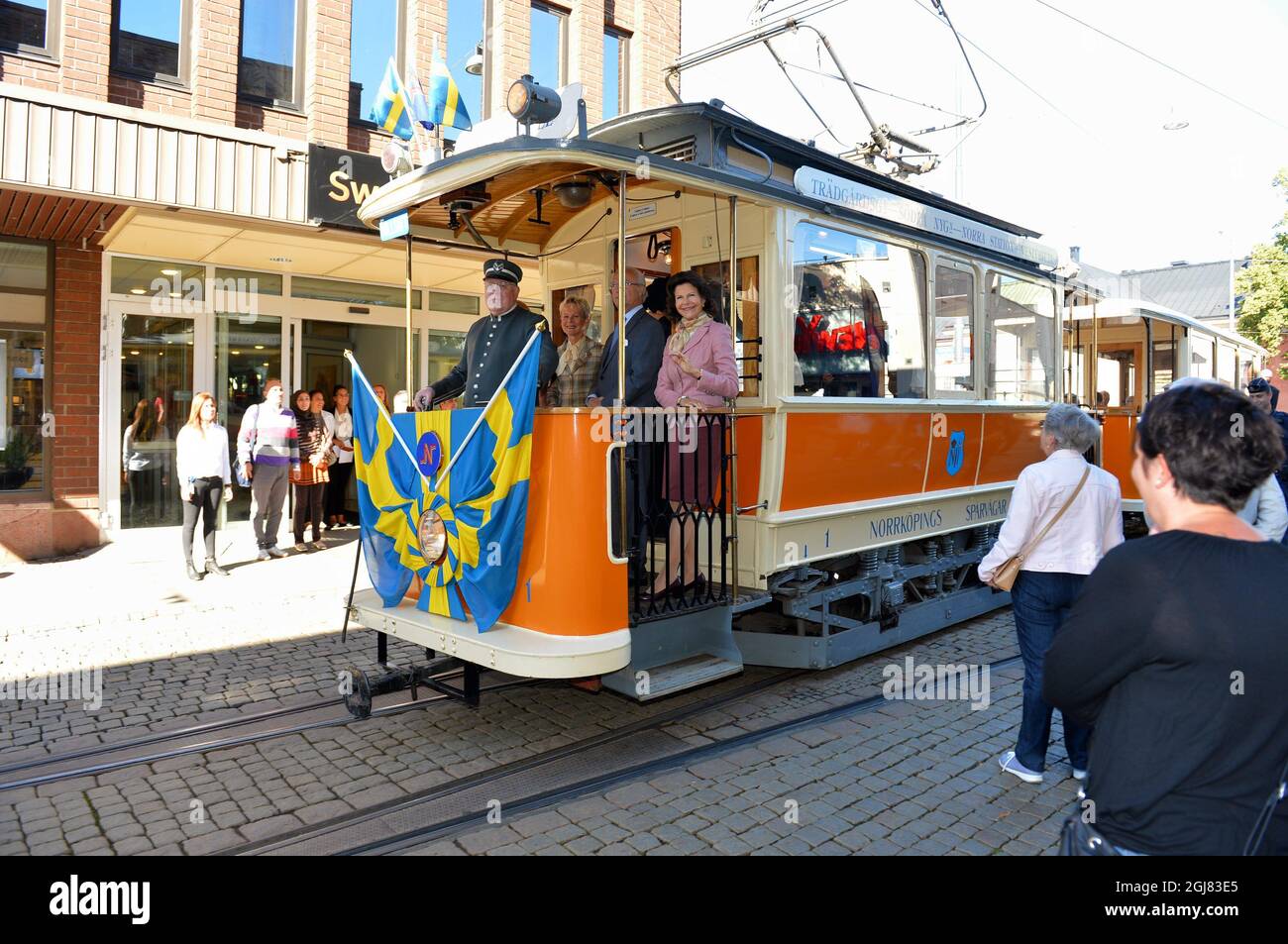 NORRKOPING 20130903 King Carl Gustaf and Queen Silvia are seen in an vintage tram in the city of Norrkoping, Sweden, September 3, 2013. The visit is a part of the Kings ongoing 40 year anniversary on the throne. Foto:Jonas Ekstromer / SCANPIX / Kod 10030  Stock Photo