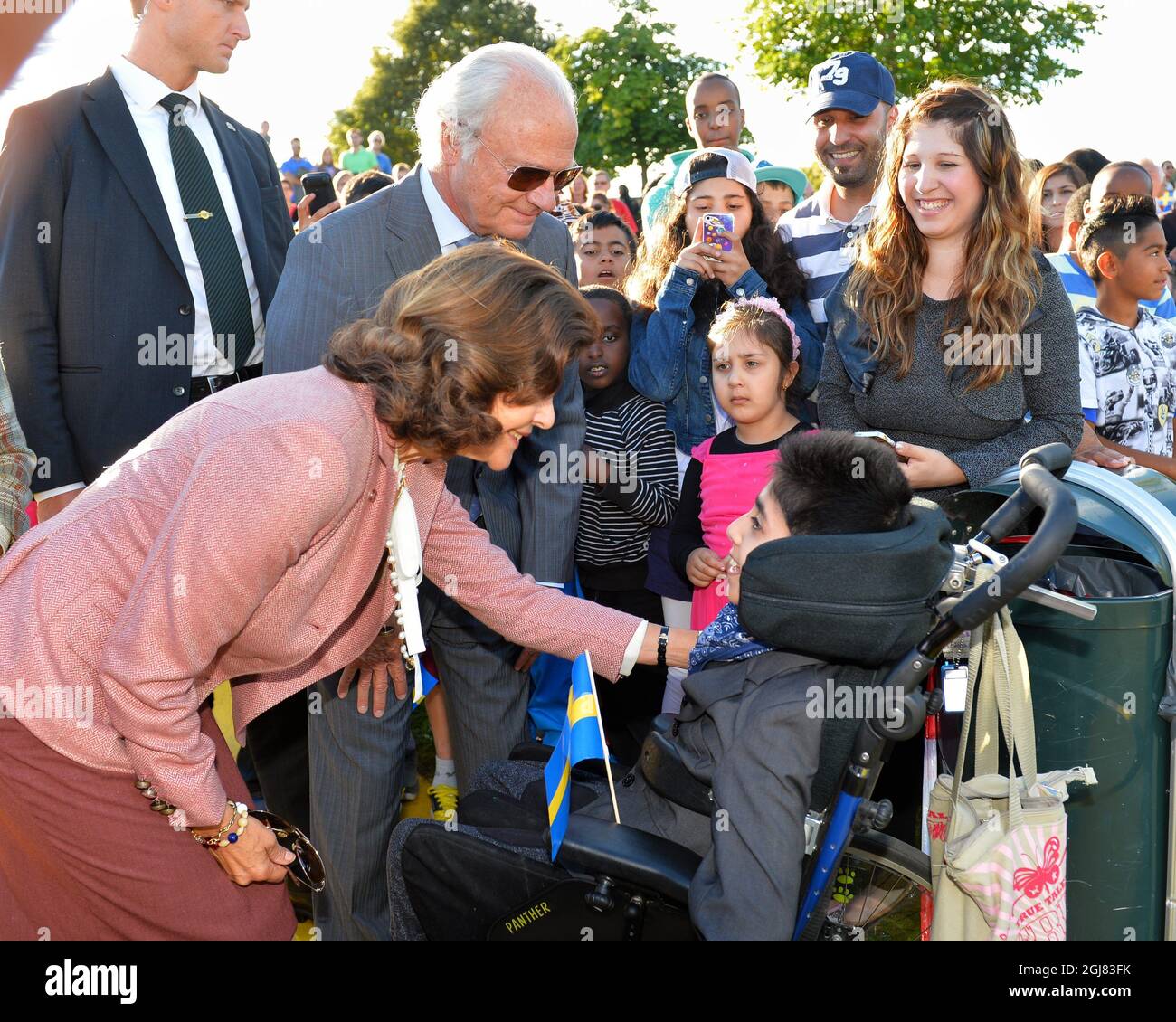 LINKOPING 20130903 King Carl Gustaf and Queen Silvia meet children during a visit to Ryd's activity park in Linkoping, Sweden, September 3, 2013. The visit is a part of the Kings ongoing 40 year anniversary on the throne. Foto:Jonas Ekstromer / SCANPIX / Kod 10030  Stock Photo