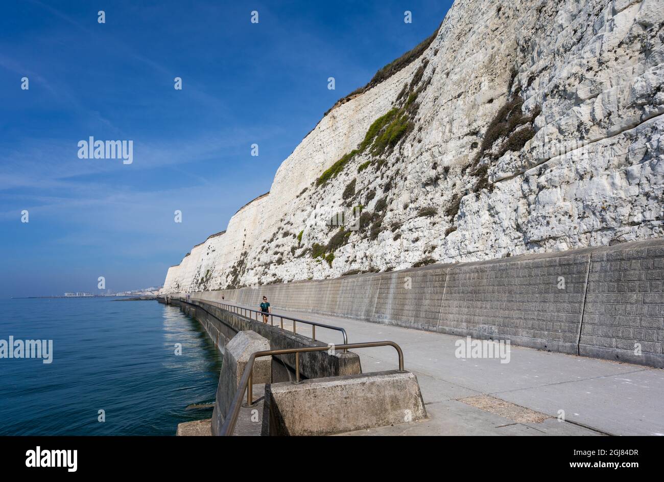Rottingdean cliff path (cliff walk) and white chalk cliffs in Summer with blue sky in Rottingdean, on the South Coast of East Sussex, England, UK. Stock Photo