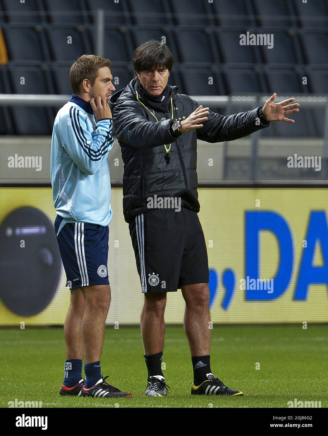 STOCKHOLM 2013-10-14 German national football team coach Joachim Loew and captain Philipp Lahm during the training at Friends Arena in Stockholm, Sweden, October 14, 2013. Germany will play against Sweden in the last World Cup qualifier Tuesday. Photo: Jonas Ekstromer / TT NEWS AGENCY ** SWEDEN OUT ** Stock Photo