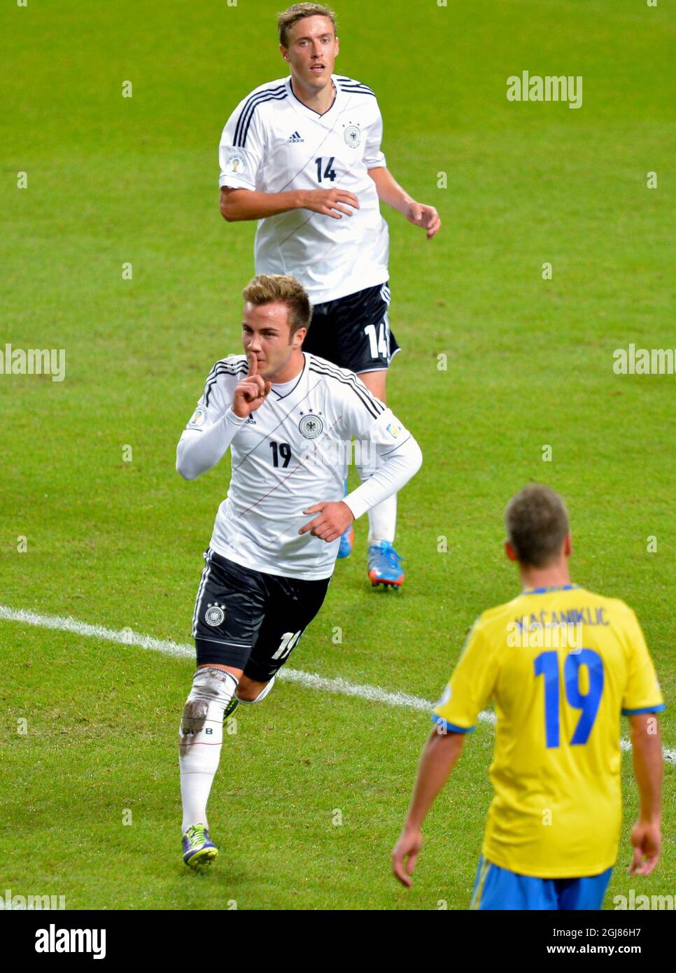 Germany's Mario Goetze (C) celebrates his 2-2 equalizing goal with team mate Max Kruse during the 2014 World Cup group C qualifying soccer match between Sweden and Germany at Friends Arena in Stockholm, Sweden, on Oct. 15, 2013. Poto: Jonas Ekstromer / TT / code 10030  Stock Photo