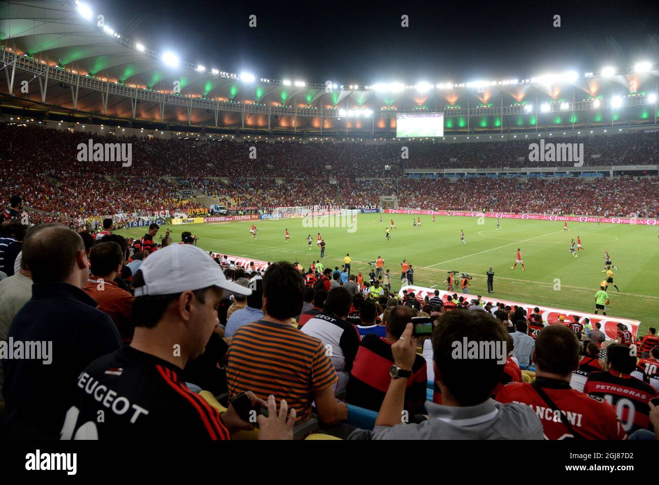 RIO DE JANEIRO 2013-10-22 * For your files* Spectators look at a soccer match in the Maracana stadium in Rio de Janeiro, October 22, 2013. The newly renovated stadium can take 80 000 spectators and will host both the final of the 2014 World Soccer Championships and the opening ceremony of the 2016 Summer Olympics. Foto:Tobias Rostlund / TT / kod 1014  Stock Photo