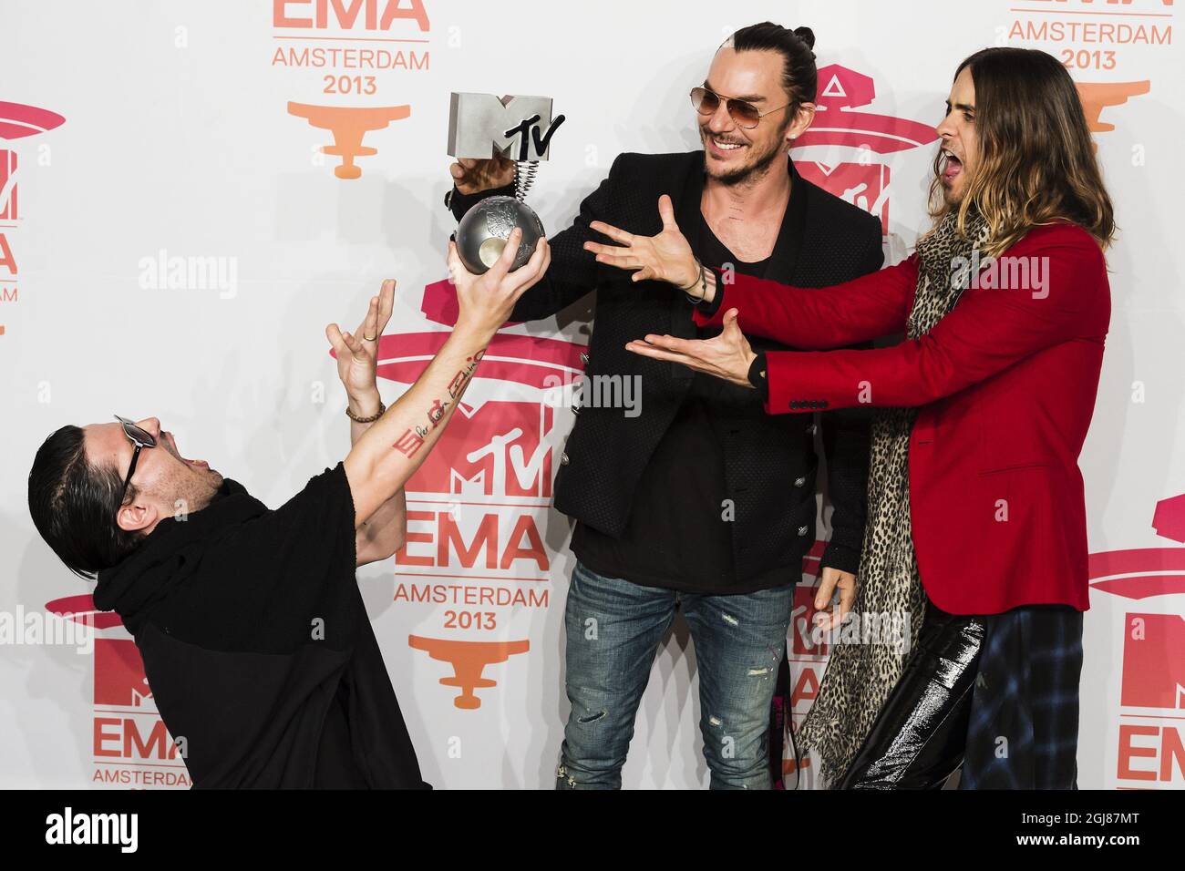 AMSTERDAM 20131110 Members of US rock band Thirty seconds to Mars (from LtoR) Tomo Milicevic, Shannon Leto and Jared Leto pose with their award during the 2013 MTV Europe Music Awards held at the Ziggo Dome in Amsterdam, Netherlands, Sunday November 10, 2013. Foto: Vilhelm Stokstad / TT / Kod 11370  Stock Photo