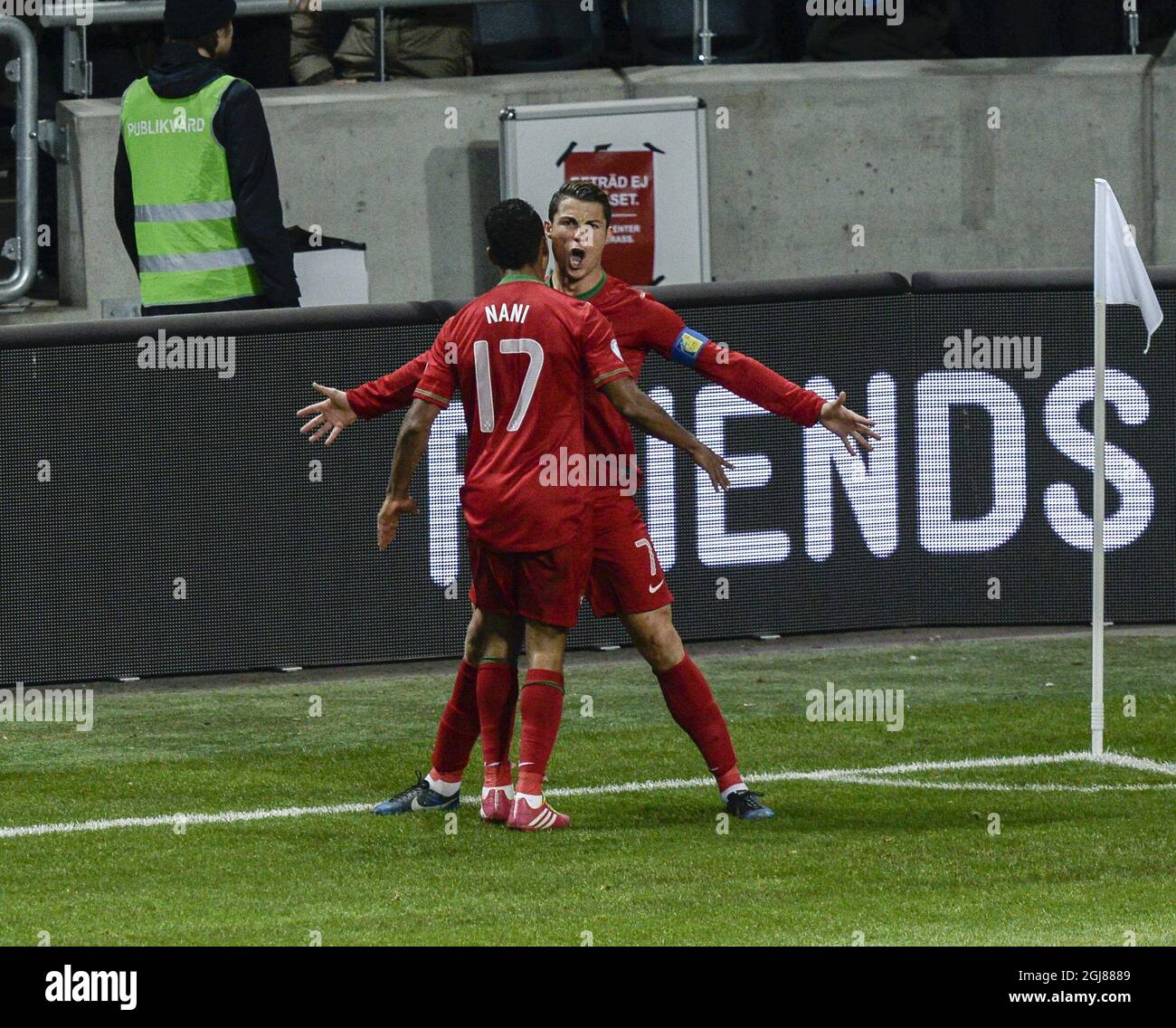 Portugal's Cristiano Ronaldo (R) celebrates scoring the 0-1 goal with team mate Nani during the FIFA World Cup 2014 qualifying playoff second leg soccer match between Sweden and Portugal at Friends Arena in Stockholm on Nov. 19, 2013. Photo: Pontus Lundahl / TT / code 10050 Stock Photo