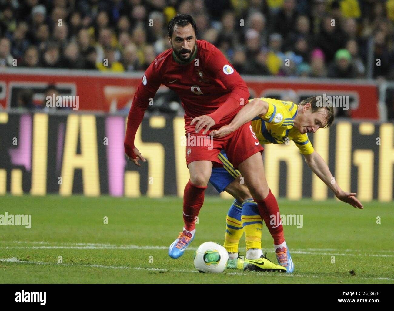 Portugal's Hugo Almeida (L) is chased by Sweden's Kim Kallstrom during the FIFA World Cup 2014 qualifying playoff second leg soccer match between Sweden and Portugal at Friends Arena in Stockholm on Nov. 19, 2013. Photo: Erik Martensson / TT / code 10400 Stock Photo