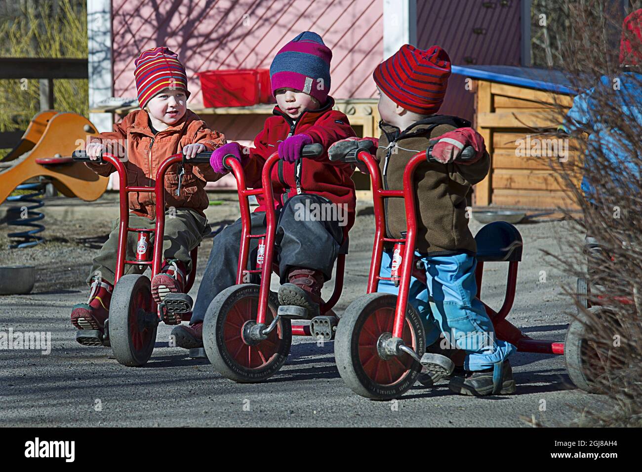 STOCKHOLM 2012-03-16 Havanna, Otis and Petter on tricycles at preschool Molntappen in Skarpnack, Stockholm, Sweden. Poto: Jan-Ake Eriksson / SCANPIX Kod 11273  Stock Photo