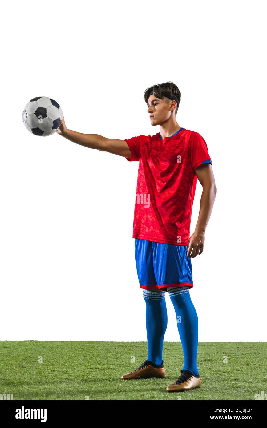 Football Player Holding Football With Both Hands Stock Photo