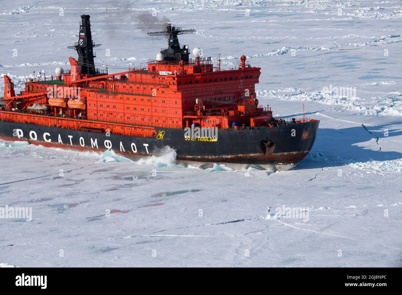 Russia. Aerial view of Russian nuclear icebreaker, 50 Years of Victory. Breaking through pack ice in High Arctic at 85.6 degrees north on the way to t Stock Photo