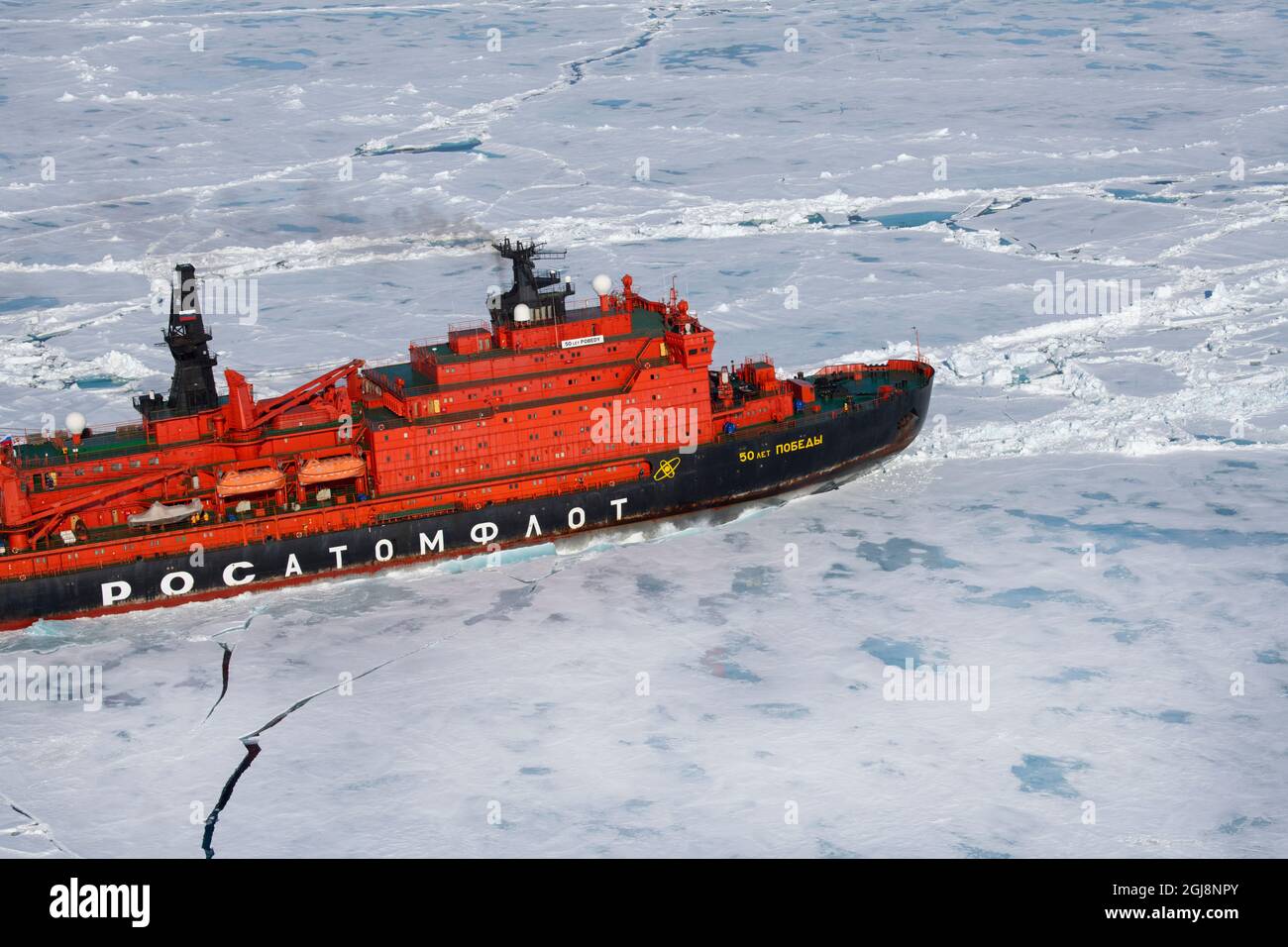 Russia. Aerial view of Russian nuclear icebreaker, 50 Years of Victory. Breaking through pack ice in High Arctic at 85.6 degrees north on the way to t Stock Photo