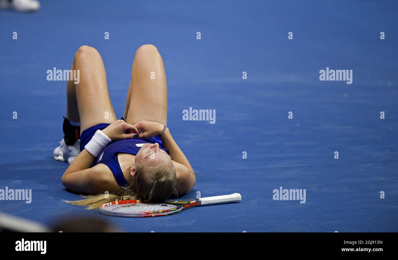 Sweden's Johanna Larsson on the floor after losing her singles match  against Switzerland's Timea Bacsinszky during the Fed Cup World Group II  1st round tennis match between Sweden and Switzerland in Helsingborg,