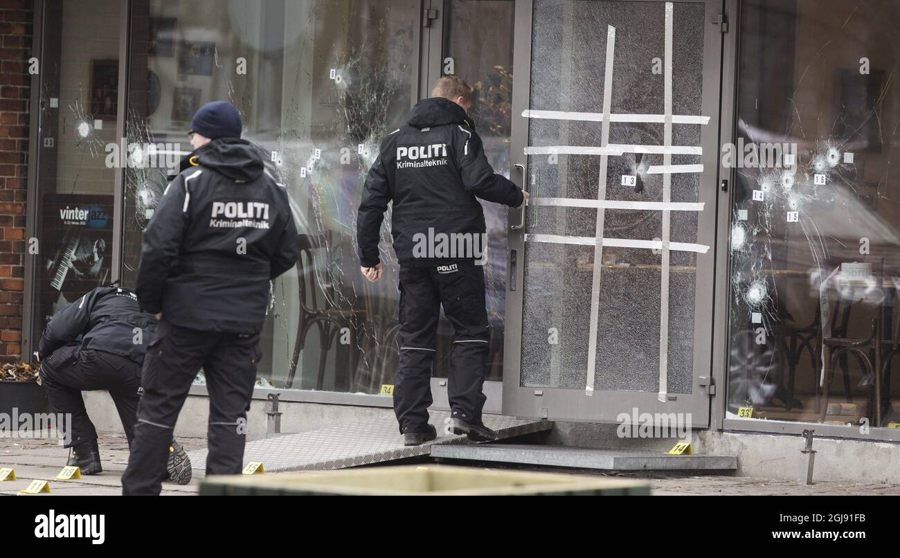 COPENHAGEN 2015-02-15 Police investigators work outside the entrance filled with bullet holes at the KrudttÃƒÂ¸nden culture club in Copenhagen, Denmark, February 15, 2015. The Danish police shot and killed a suspected terrorist early Sunday morning. The man killed is suspected of the attacks against the main synagogue and a debate on Islam and free speech with Swedish cartoonist Lars Vilks at the KrudttÃƒÂ¸nden culture club. Photo: Ola Torkelsson / TT / Kod 75777 ** SWEDEN OUT **  Stock Photo