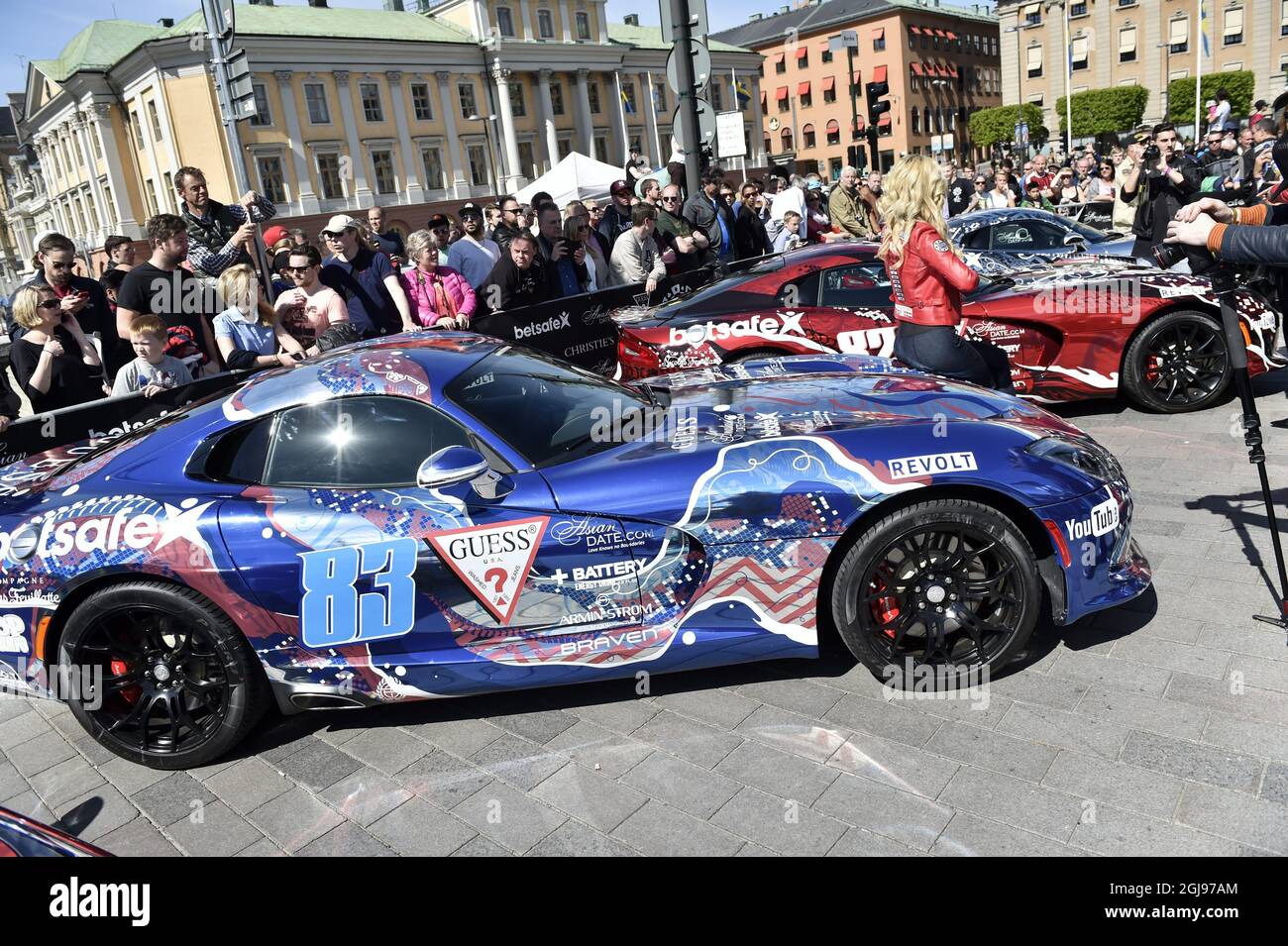 STOCKHOLM 2015-05-24 Onlookers wait for the annual international rally  Gumball 3000 sto start from Norrbro in central Stockholm on Sunday May 24,  2015. This year the route is from Stockholm via Oslo,