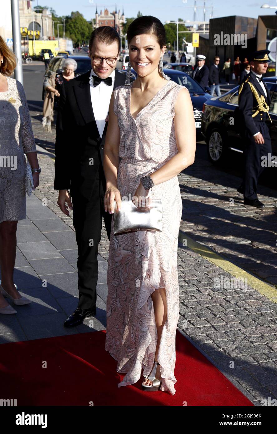 STOCKHOLM 2015-06-09 Crown Princess Victoria and Prince Daniel arrives to the Polar Music Awardwinners reception in the Grand Hotel in Stockholm, Sweden, June 9, 2015. Crown Princess chose large earrings from Oscar de la Renta. and dress 'Deborah' from House of Dagmar, Swedish design. Clutch bag from Anya Hindmarch. Foto Patrik C Osterberg / TT / kod 4571  Stock Photo