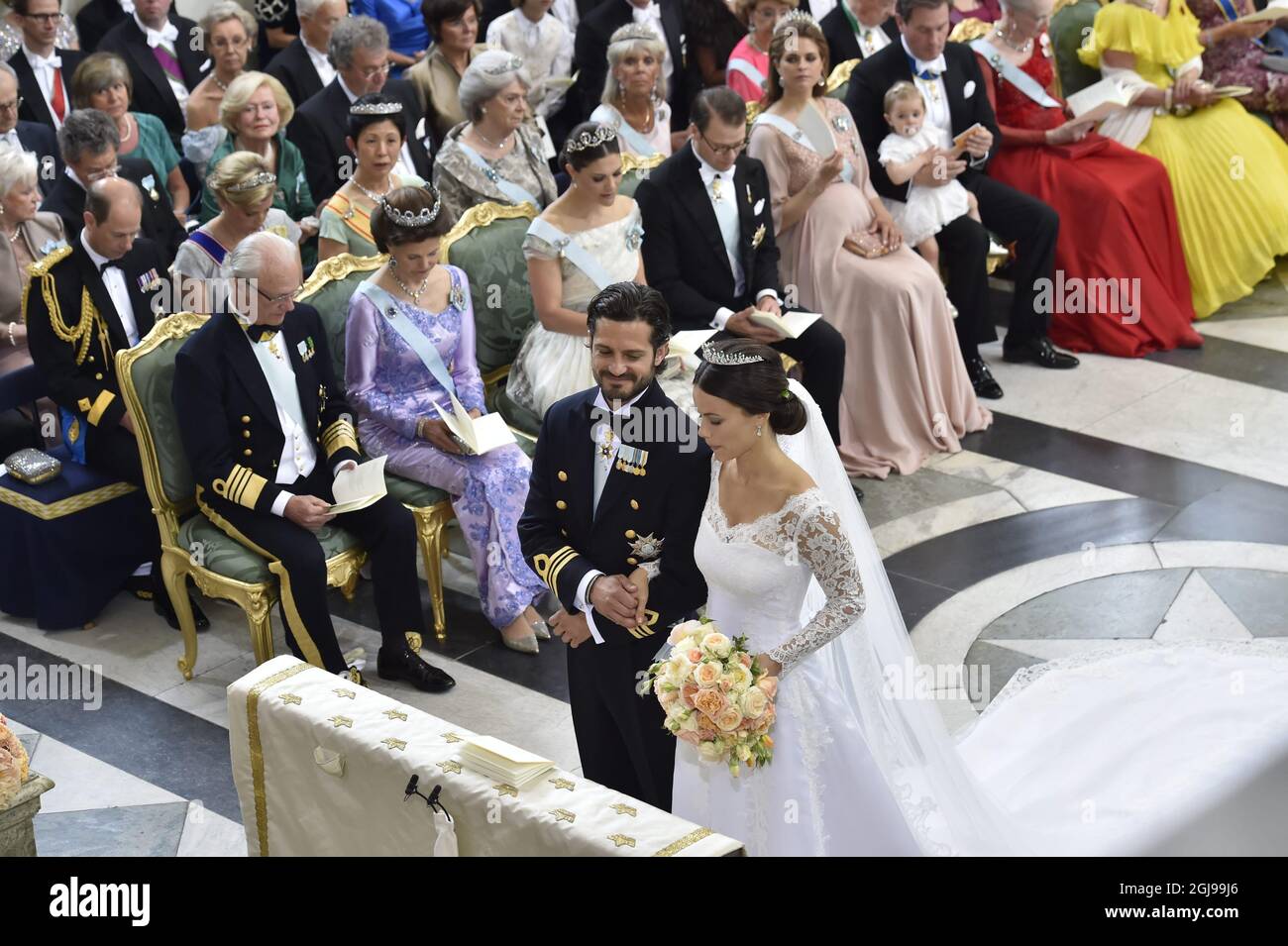 Prince Carl Philip and Sofia Hellqvist during their wedding in the Royal Chapel in Stockholm, Sweden, June 13, 2015. In the background King Carl Gustaf, Queen Silvia, Crown Princess Victoria, Prince Daniel Princess Madeleine. Stock Photo