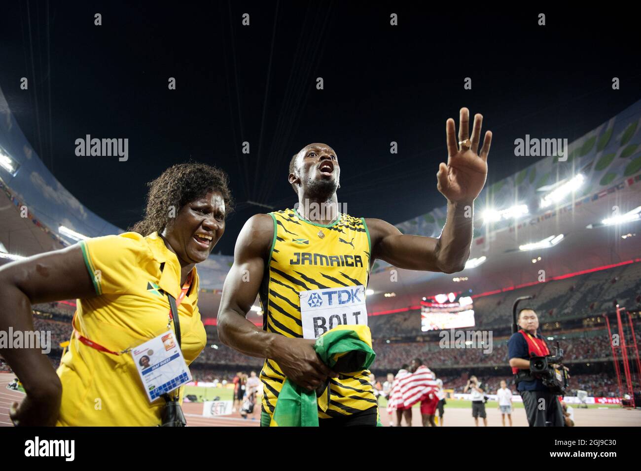 BEIJING 20150823 Usain Bolt of Jamaica with his mother Jennifer Bolt after winning the men's 100m final during the Beijing 2015 IAAF World Championships at the National Stadium in Beijing, China, August 23, 2015. Photo: Jessica Gow / TT / Kod 10070  Stock Photo