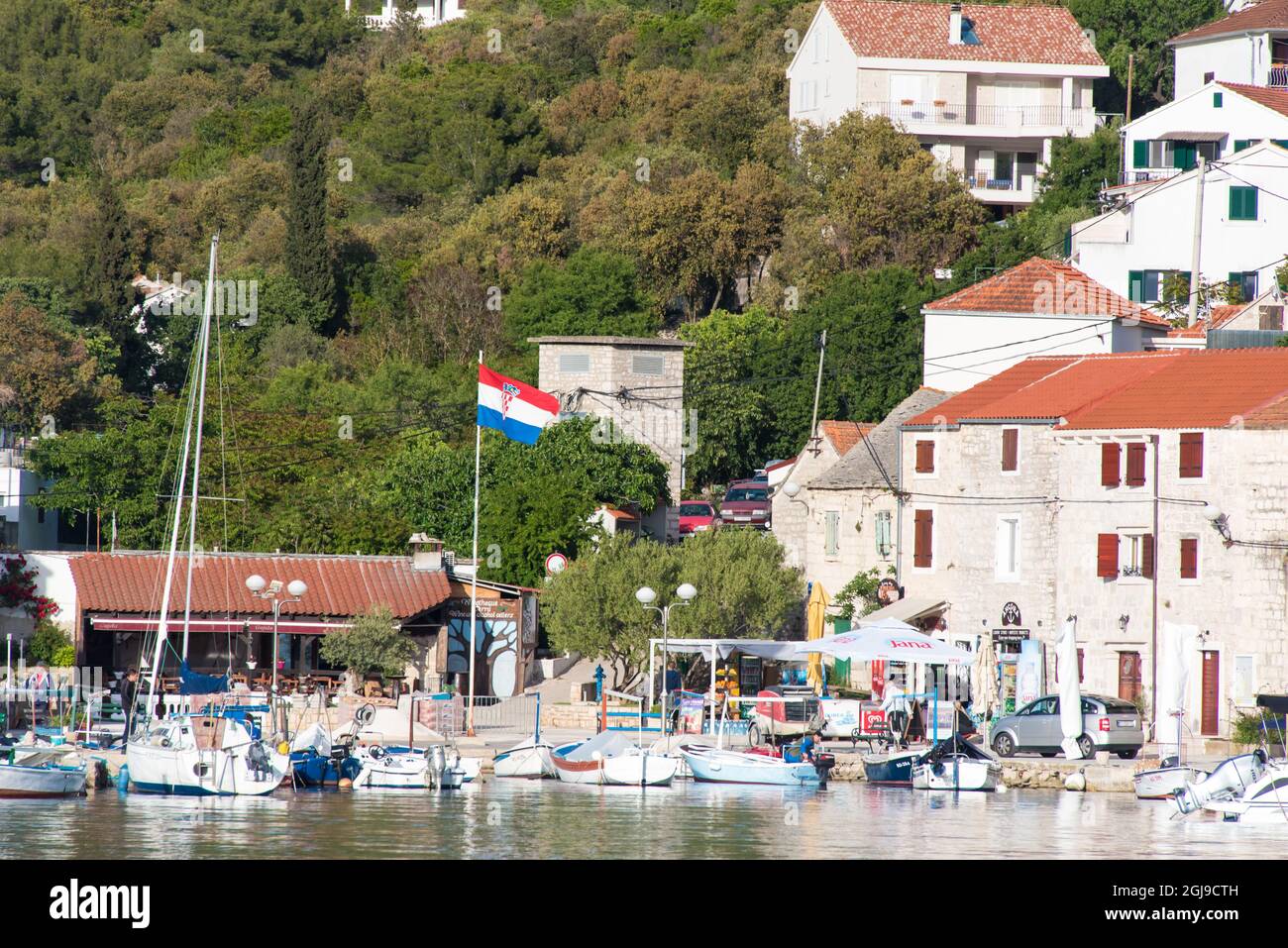 Europe, Croatia, Maslinica, Solta Island. Fishing village popular with charter boats provides cafes and provisioning Stock Photo