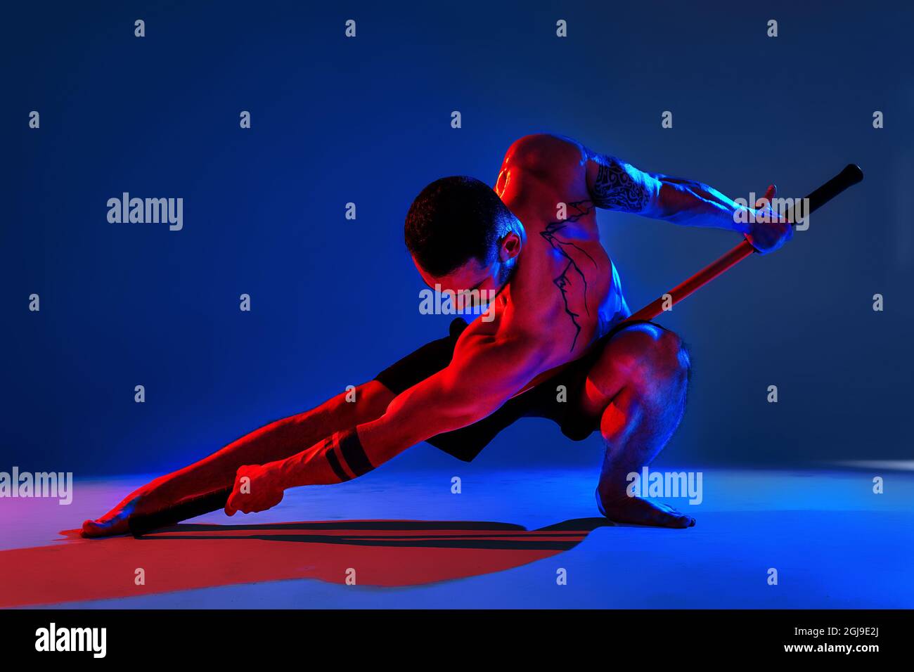 athlete men silhouette with stick training karate using sports tool in