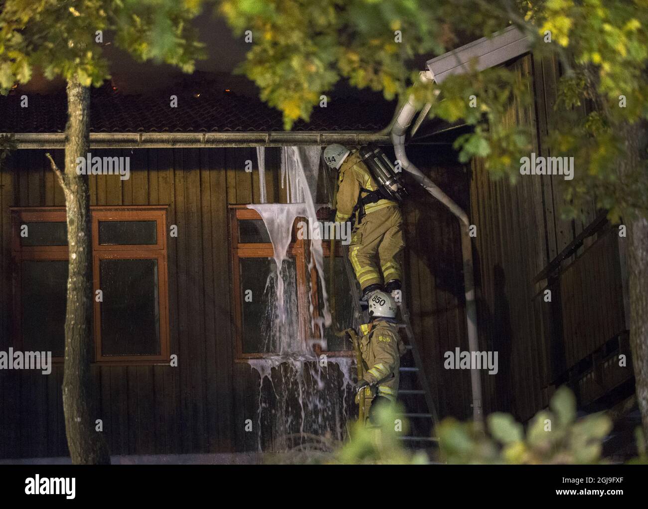 ONSALA 2015-10-18 Firefighters are working to battle a fire at the Furulid School in Kungsbacka south of Goteborg, Sweden, October 18, 2015. The former school was undergoing construction work to house 170 asylum seekers and was empty at the time of the fire. The fire was the third this week in Sweden that has affected houses or shelters that were supposed to house asylum seekers. The Swedish Police Department of National Operations (NOA) Sunday recommended the police districts in the country to increase surveillance around asylum housings. Photo: Bjorn Larsson Rosvall / TT / Kod 9200 Stock Photo