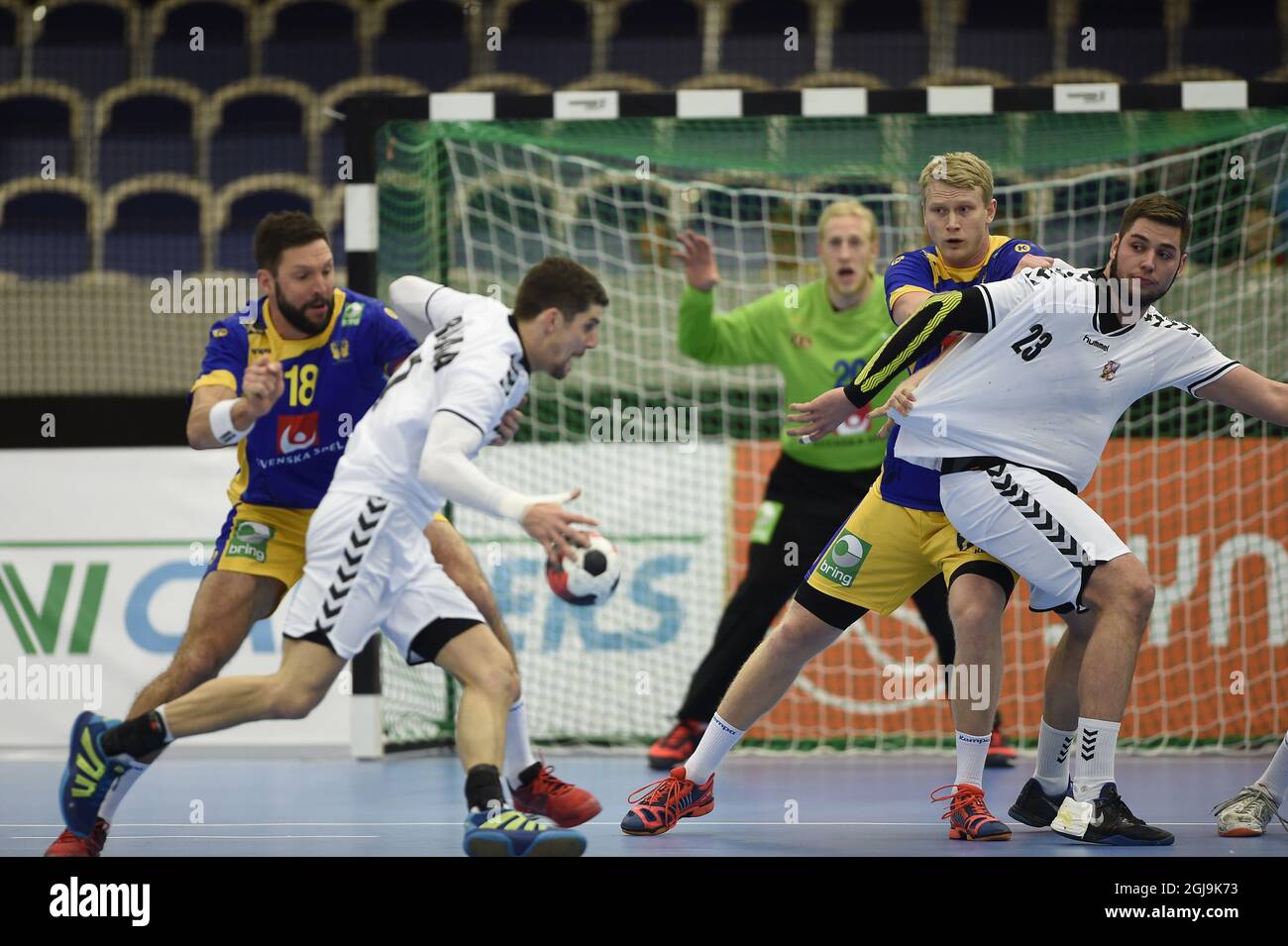 MALMO 20160105 Czech Ondrej Zdrahala, left, and Leos Petrovsky fight with Sweden's Tobias Karlsson (18) and an unidetified player during the friendly handball match between Sweden and Czech Republic in Malmo, Sweden, on Jan. 05, 2016. Photo: Bjorn Lindgren / TT / code 9204  Stock Photo
