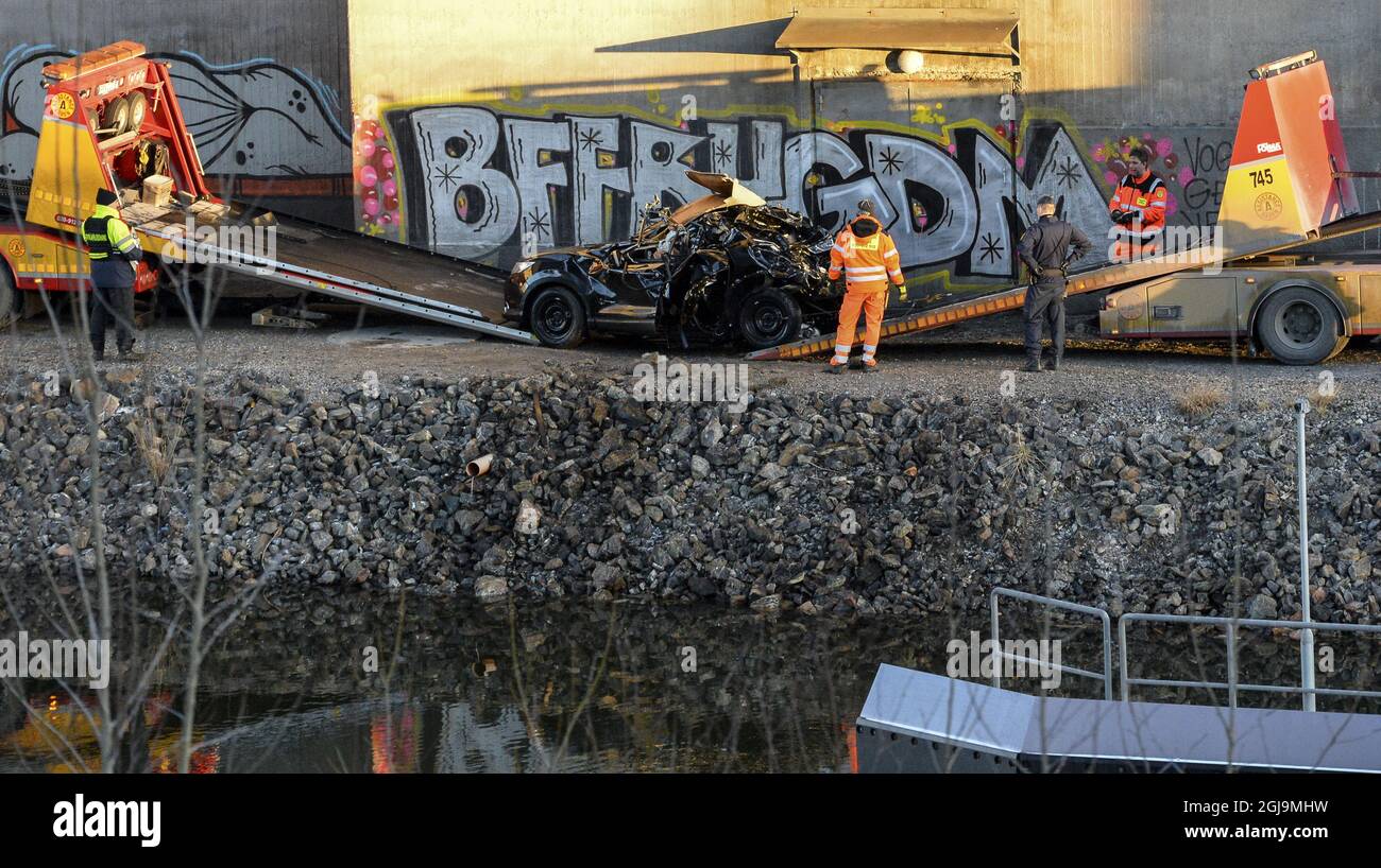 ** NEW INFO! The five men killed in the bridge car crash were British citizens ** SODERTALJE 2016-02-13 A badly damaged car is towed up from the canal under the E4 highway bridge in Sodertalje, Sweden, February 13, 2016. Police on Sunday confirmed that the five men killed when their car ran through the gate and flew off the 29 meters high open highway bridge early Saturday morning are British citizens. The bridge had been opened to let a cargo ship pass under it and other cars had stopped in front of the gate and red lights. It is under investigation why the crashed car failed to stop. Photo:  Stock Photo