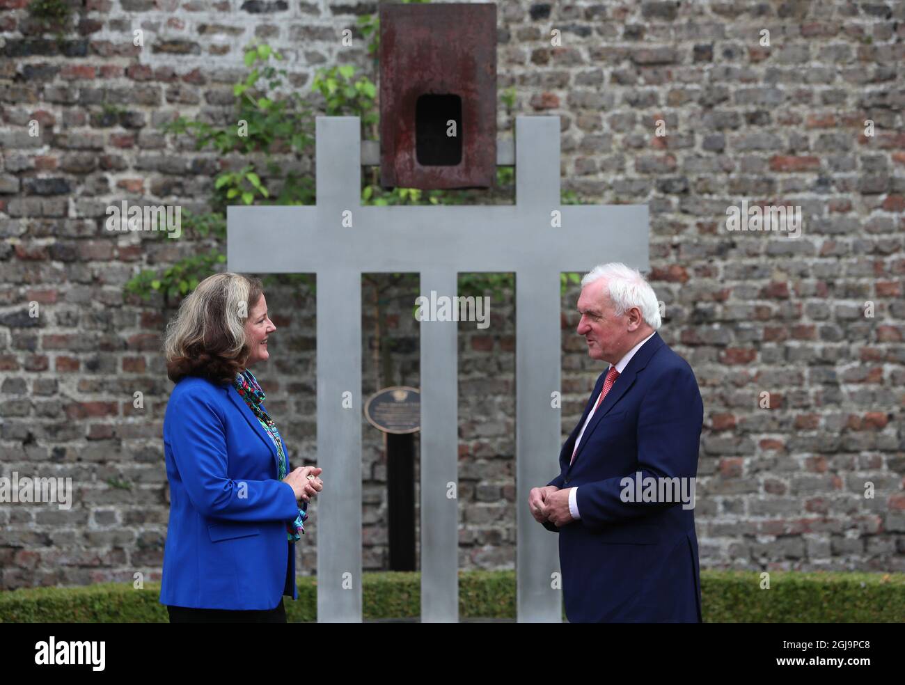 Former Taoiseach Bertie Ahern (right) in conversation with Charge d'Affaires Alexandra McNight in front of a 9/11 memorial at the US Ambassador's Residence in Dublin, during a 20th anniversary event to commemorate the lives lost during the 9/11 attacks. Picture date: Wednesday August 25, 2021. Stock Photo