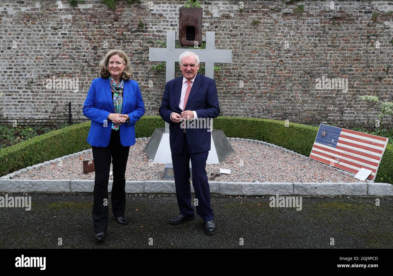 Former Taoiseach Bertie Ahern (right) in conversation with Charge d'Affaires Alexandra McNight in front of a 9/11 memorial at the US Ambassador's Residence in Dublin, during a 20th anniversary event to commemorate the lives lost during the 9/11 attacks. Picture date: Wednesday August 25, 2021. Stock Photo