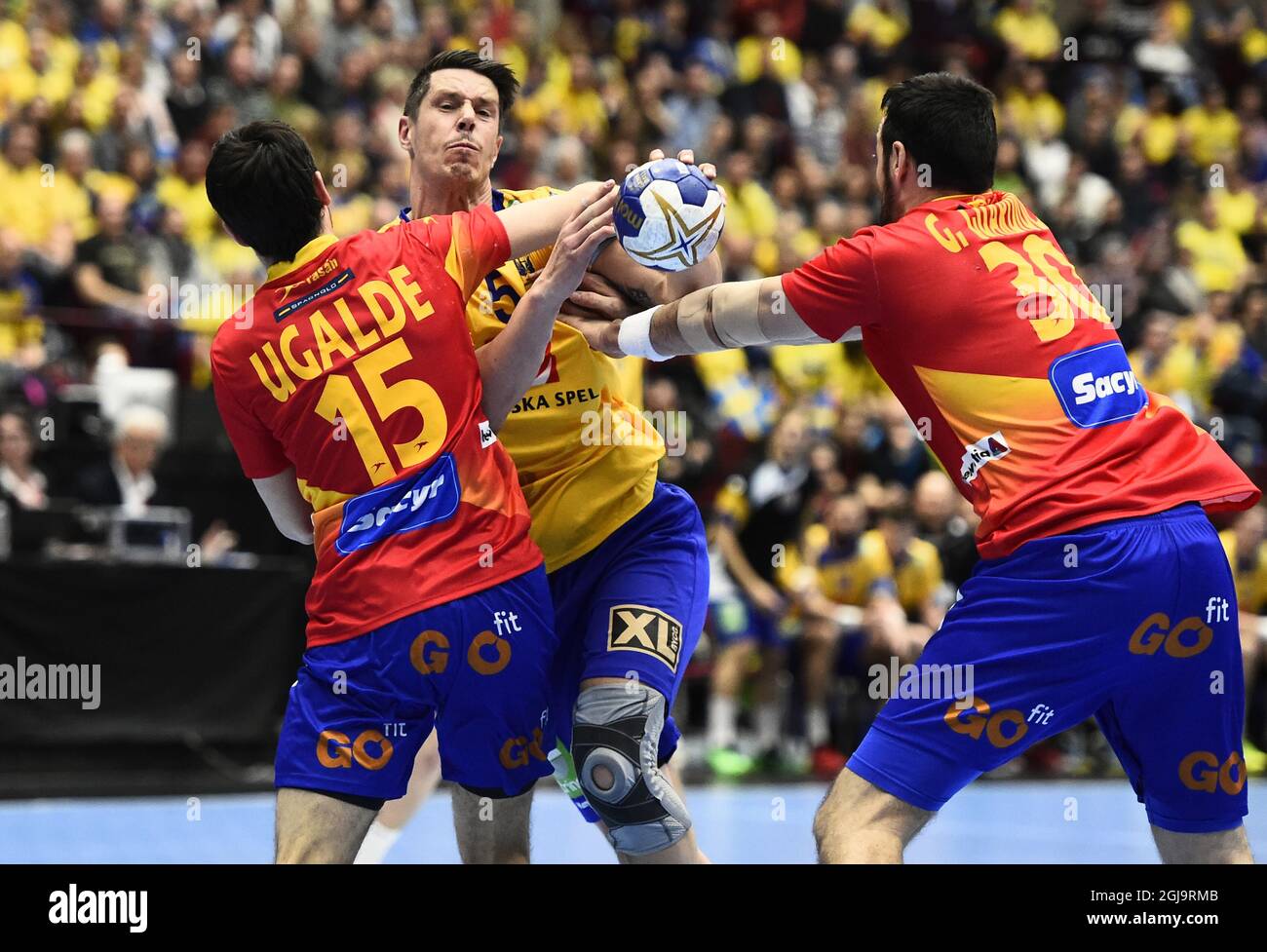 Swedens Kim Andersson stoped by Spain's Cristian Ugalde and Gedeon Guardiola during Sunday April 10, 2016 men's handball Olympic Qualification Tournament group 2 between Sweden and Spain in Malmo. Photo Emil Langvad / TT Stock Photo