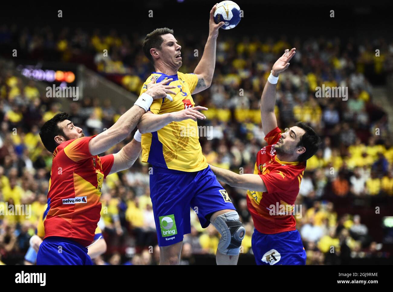 Sweden's Kim Andersson between Spain's Gedeon Guardiola and Cristian Ugalde during the men's handball Olympic Qualification Tournament group 2 between Sweden and Spain at Malmo Arena in Malmo, Sweden, April 10, 2016. Photo Emil Langvad / TT Stock Photo